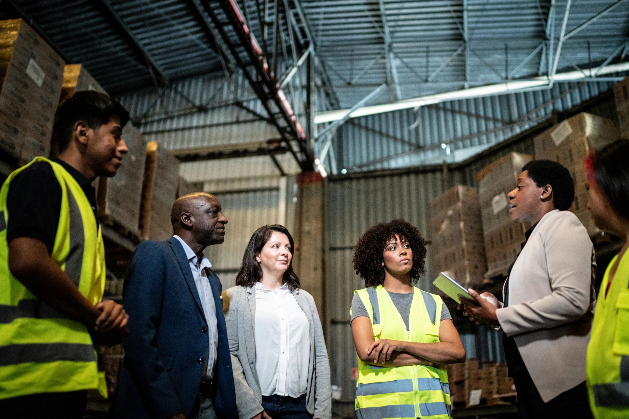 Logistics team meeting in a warehouse