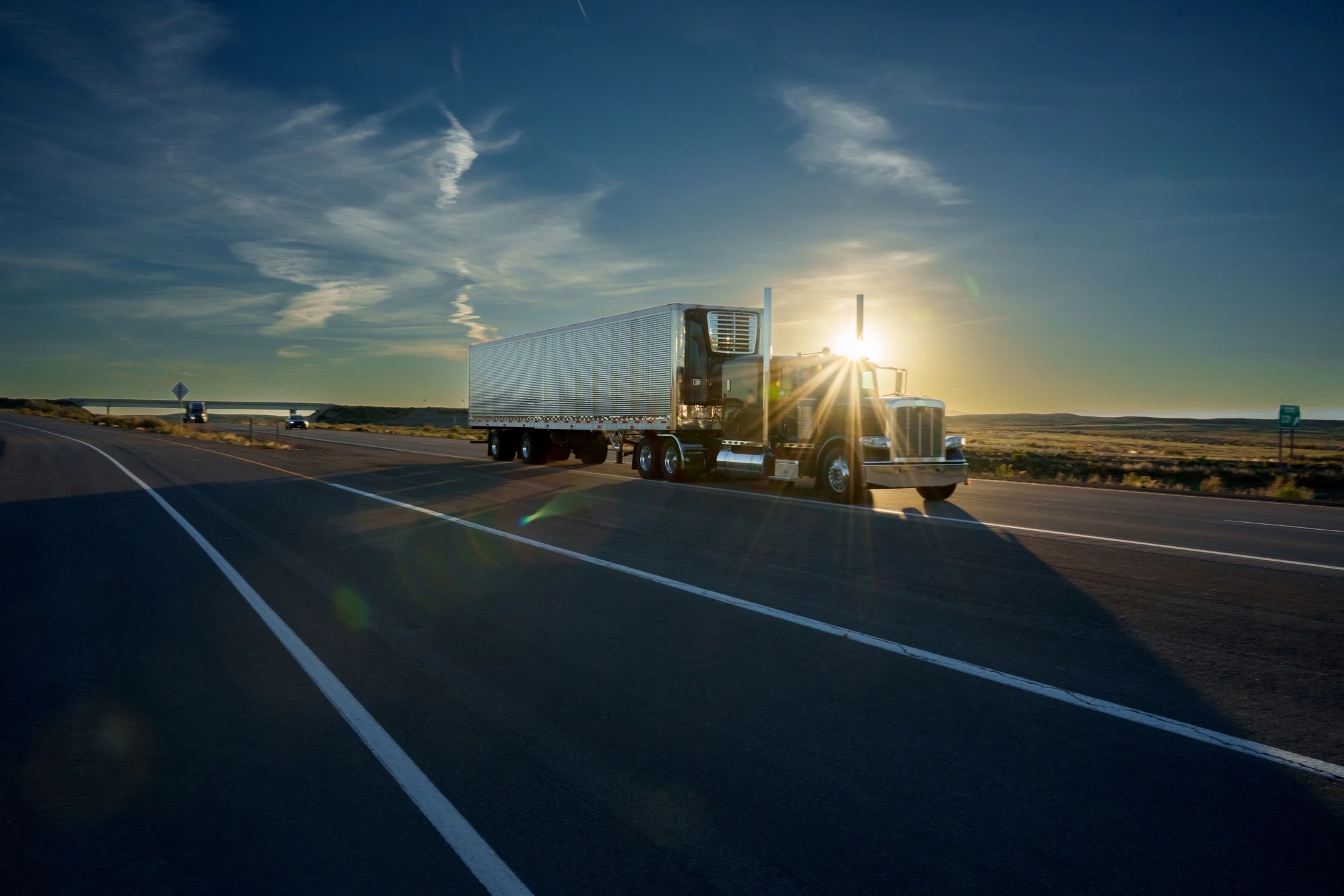 Crew cab box truck on highway representing expedited freight